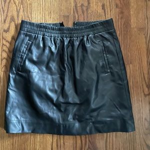 Loft black faux leather skirt with pockets . Elastic waist , SP